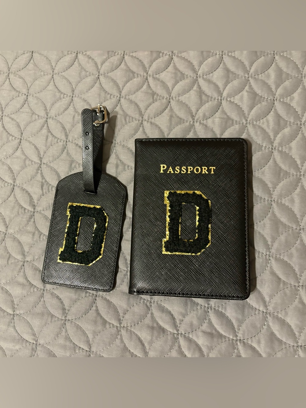 Amazon Black Passport Cover and Luggage Tag Set with 'D' initial.